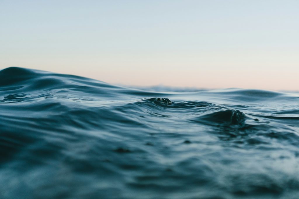 soft waves with sunset in the background 