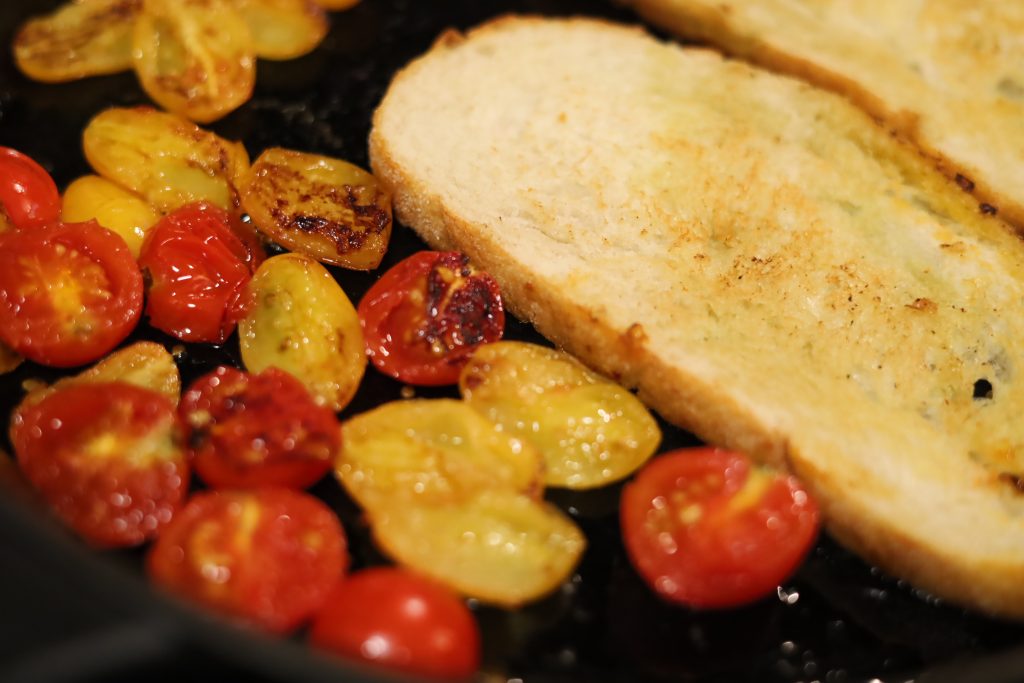 grilled bread and tomatoes in pan for cooking