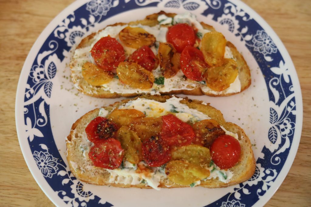 up close photo of tomato and ricotta toast