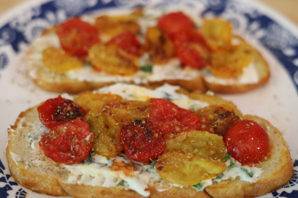 ricotta toast with tomatoes on a plate